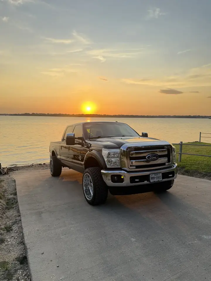 2011 Ford F-250 Lariat custom diesel street truck at sunset