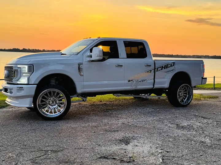 Driver side of the 2017 Ford F-250 on KG1 TAZE 24x14 forged wheels and 33-inch Fury MT2 tires