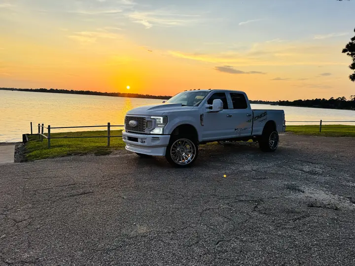 Summit White 2017 Ford F-250 Super Duty on KG1 TAZE wheels at sunset